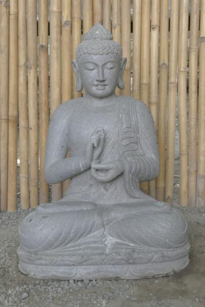 Product image of the product “Seated Buddha made of Riverstone in Dharmachakra gesture of wheel of the teaching of the Dharma, H. 83cm. There is a stone eye on the left shoulder. ”